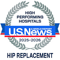 A badge with laurel leaves reads High Performing Hospitals, U.S. News & World Report, 2025-2026, Hip Replacement in blue and gray text on a white background.