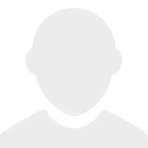 A simple gray silhouette of a person’s head and shoulders on a white background, commonly used as a generic profile or avatar placeholder image.